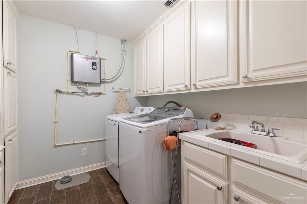 1902 Sundance Street Palmhurst, TX 78573 - Photo 30 of 43 a room with storage and utility