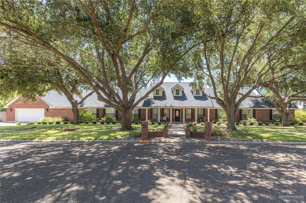 1902 Sundance Street Palmhurst, TX 78573 - Photo 3 of 43 a front view of a house with a yard