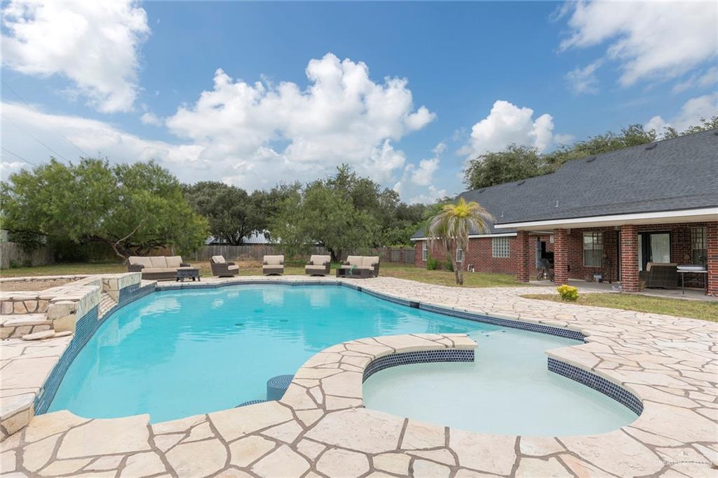 1902 Sundance Street Palmhurst, TX 78573 - Photo 32 of 43 a view of a swimming pool and lounge chair