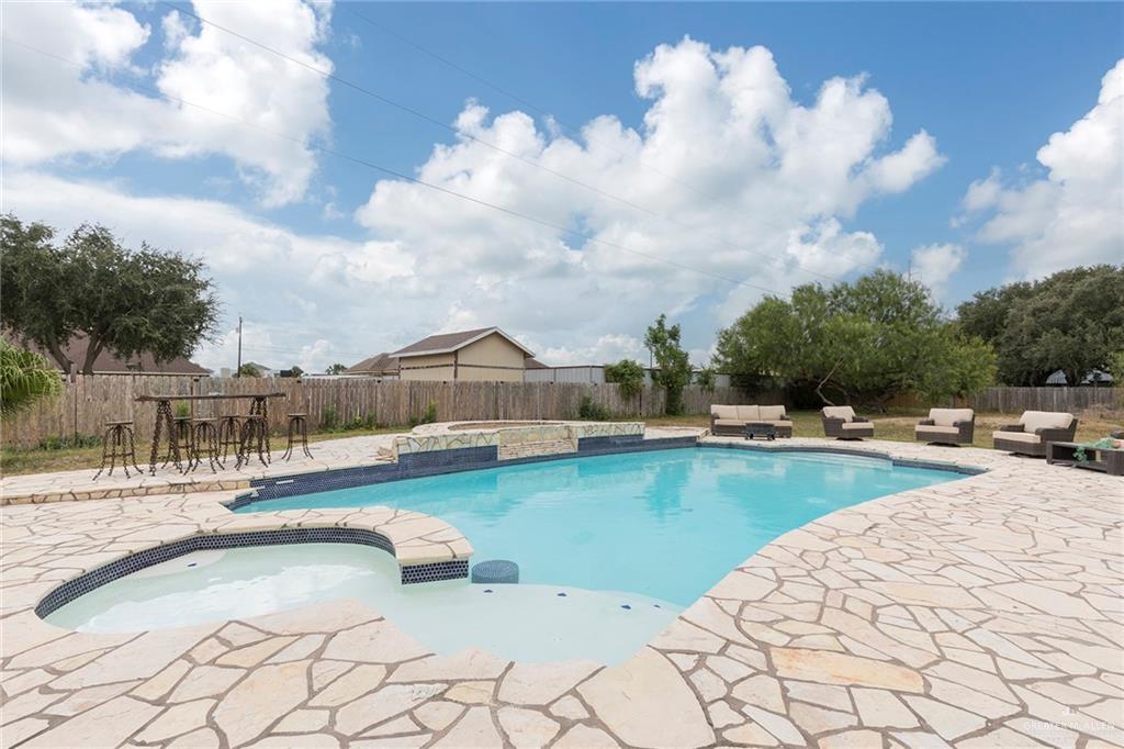 1902 Sundance Street Palmhurst, TX 78573 - Photo 33 of 43 a view of swimming pool from lake view