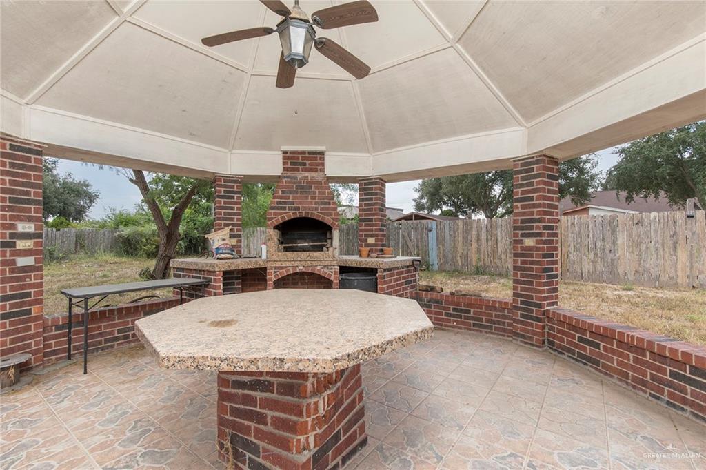 1902 Sundance Street Palmhurst, TX 78573 - Photo 35 of 43 a table and chairs in a patio