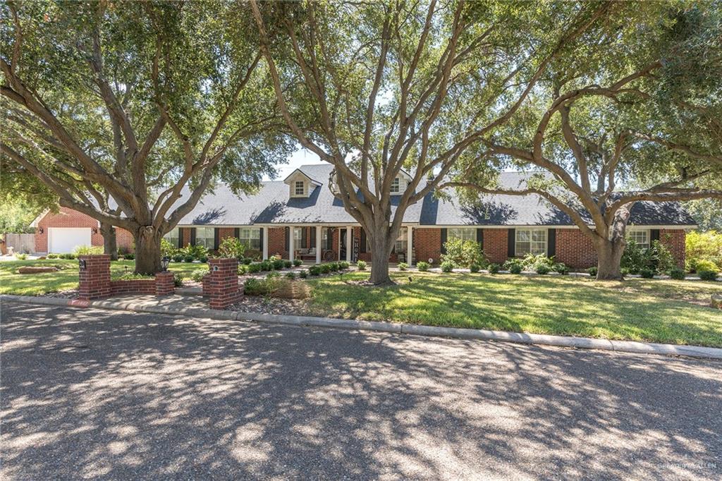 1902 Sundance Street Palmhurst, TX 78573 - Photo 4 of 43 a front view of a house with a yard