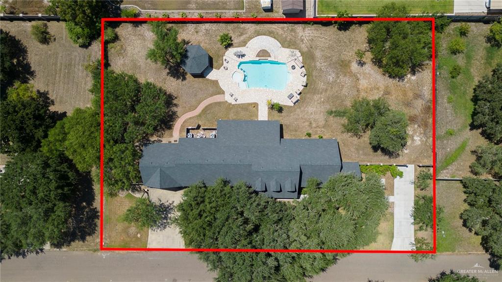 1902 Sundance Street Palmhurst, TX 78573 - Photo 43 of 43 an aerial view of a house with a yard and a large tree
