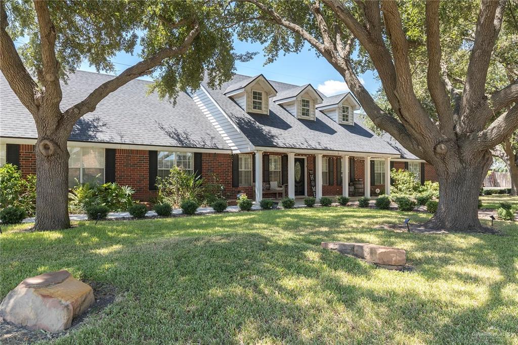 1902 Sundance Street Palmhurst, TX 78573 - Photo 6 of 43 a front view of a house with a yard