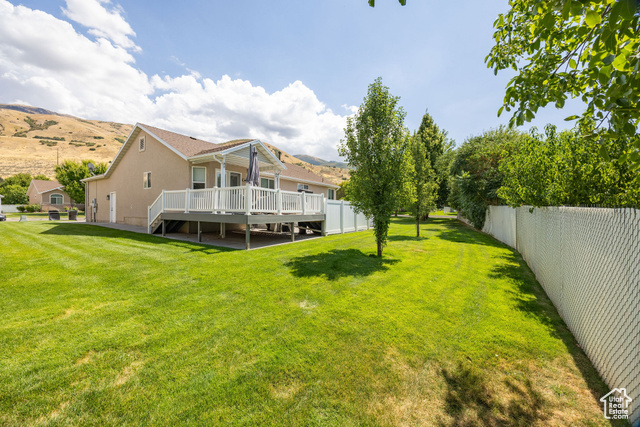 2280 South 450 West Perry, UT 84302 - Photo 36 of 38 Fenced backyard with a deck