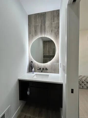 a bathroom with a sink and a mirror