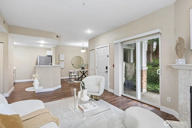 a living room with furniture a dining table and chairs