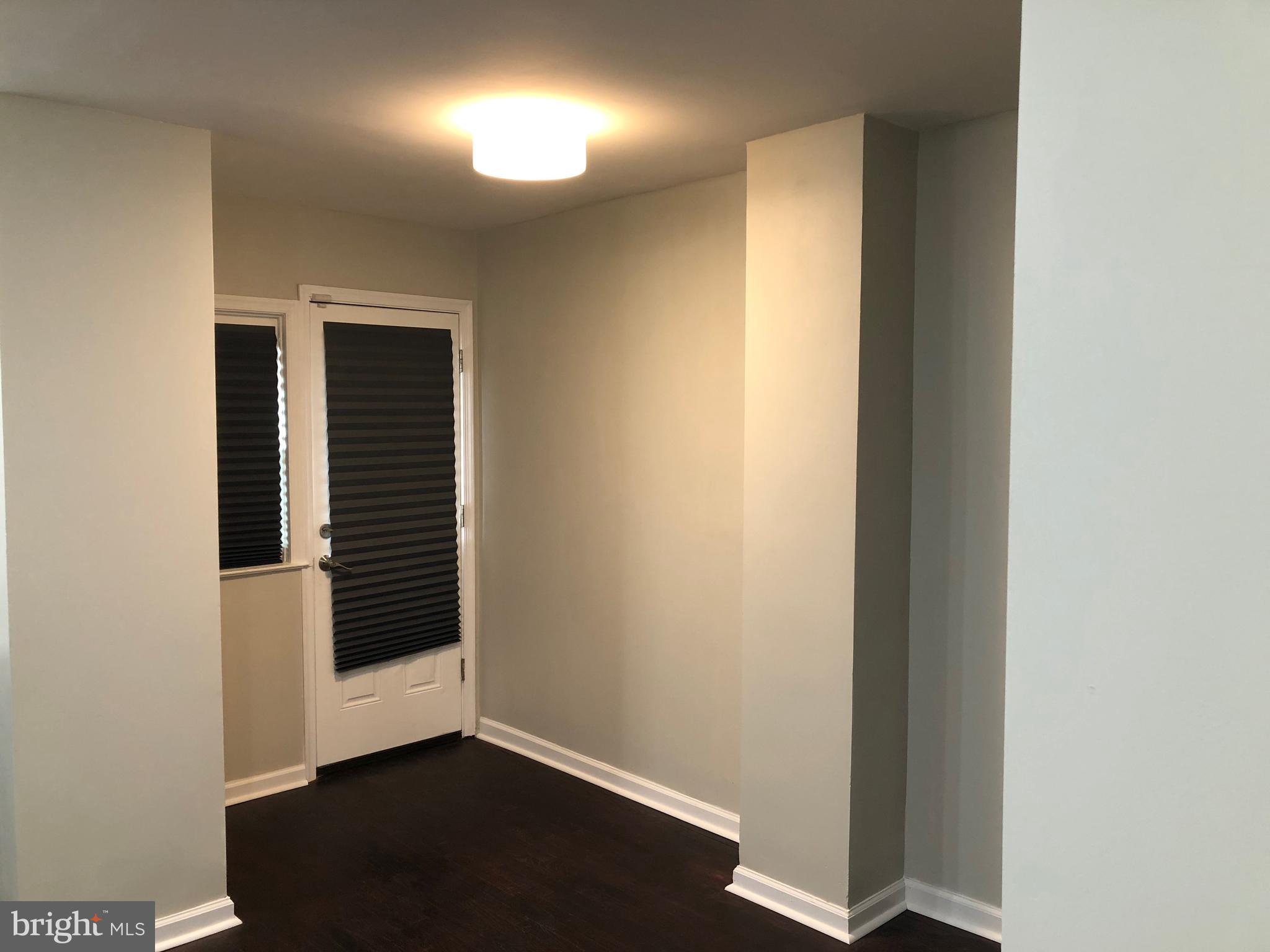 317 West Arundel Road Baltimore, MD 21225 - Photo 6 of 25 From the kitchen exit to the backyard.