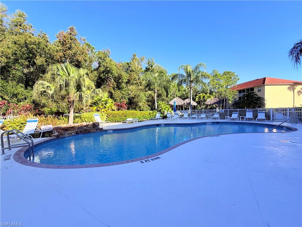 9175 Celeste Drive, Unit 2 Naples, FL 34113 - Photo 11 of 13 a view of swimming pool from a balcony
