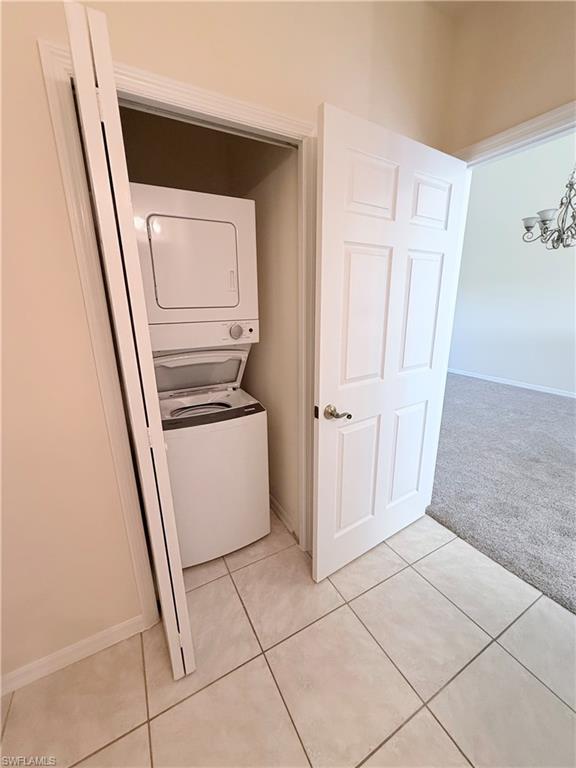 9175 Celeste Drive, Unit 2 Naples, FL 34113 - Photo 6 of 13 a view of a storage and utility room with refrigerator