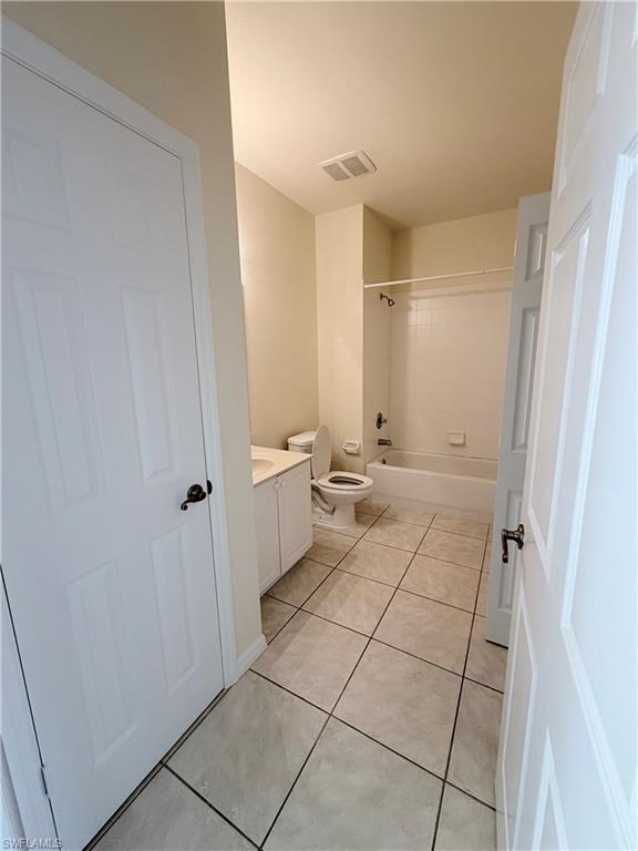 9175 Celeste Drive, Unit 2 Naples, FL 34113 - Photo 7 of 13 a bathroom with a sink and a mirror