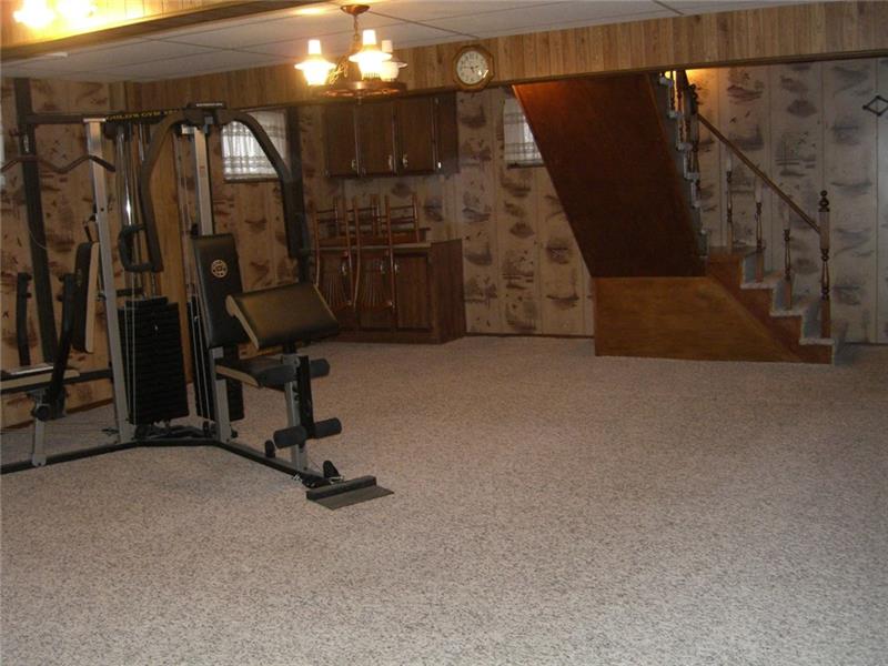 268 Chestnut Ridge Road Washington, PA 15301 - Photo 21 of 24 Very large lower level game room. This room could easily be converted to a third bedroom or apt. There is a powder room and a shower could be easily added there to make a full bath. The seller is offering a $10,000 credit for these items to be completed.