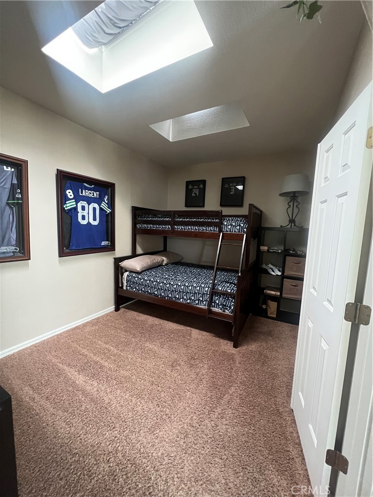 1189 Marina Drive Needles, CA 92363 - Photo 13 of 26 a bedroom with a bed and a dresser
