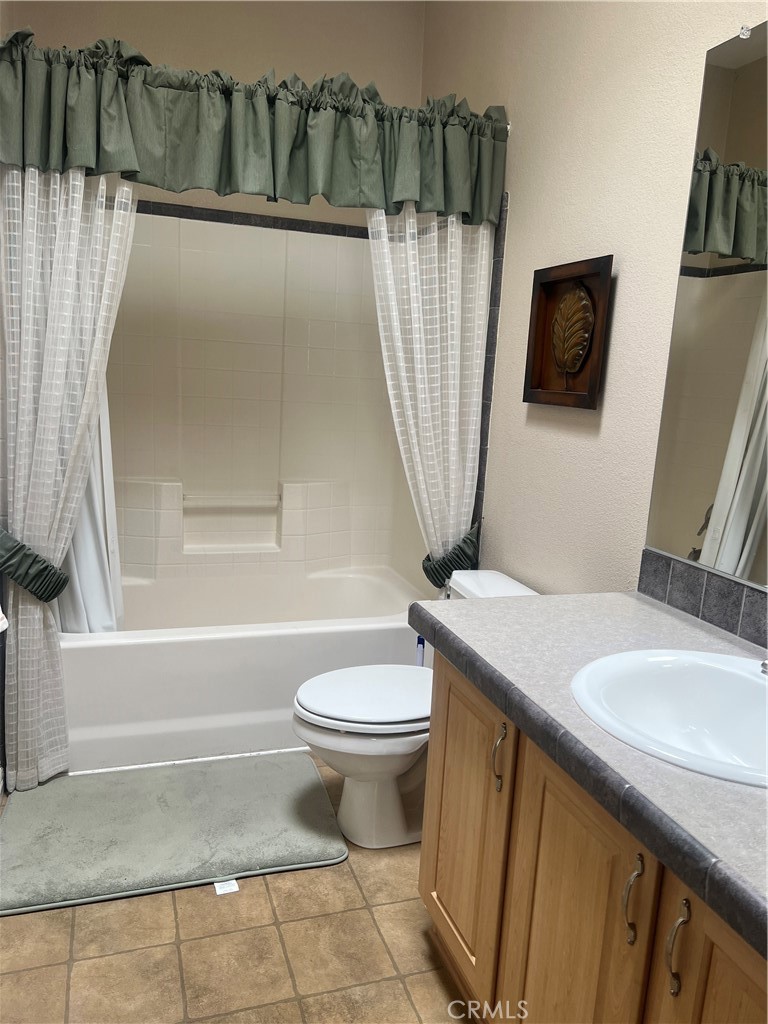 1189 Marina Drive Needles, CA 92363 - Photo 14 of 26 a bathroom with a sink toilet and shower