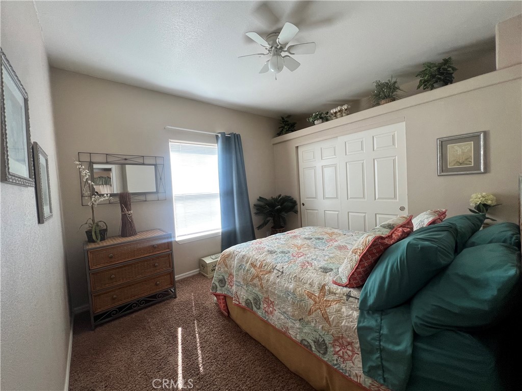 1189 Marina Drive Needles, CA 92363 - Photo 16 of 26 a bedroom with a bed and a window