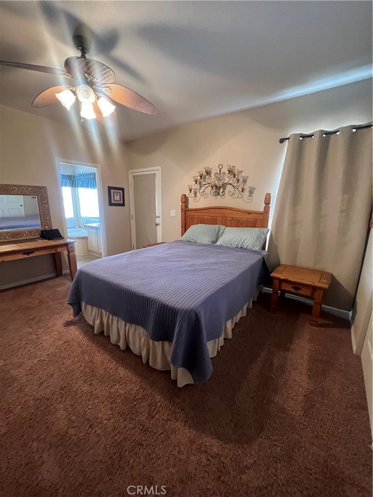 1189 Marina Drive Needles, CA 92363 - Photo 18 of 26 a bed sitting in a room next to a window