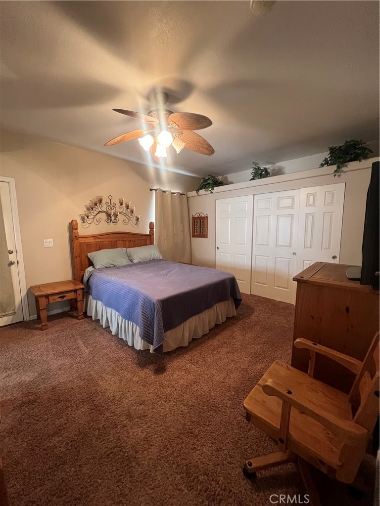 1189 Marina Drive Needles, CA 92363 - Photo 19 of 26 a bedroom with a bed and a couch