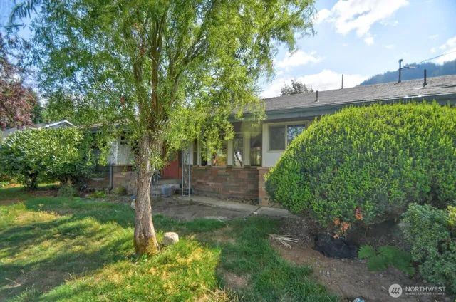 a backyard of a house with lots of green space