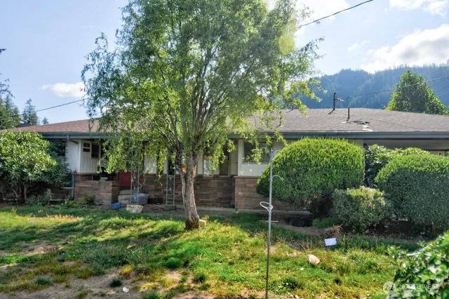 a backyard of a house with lots of green space