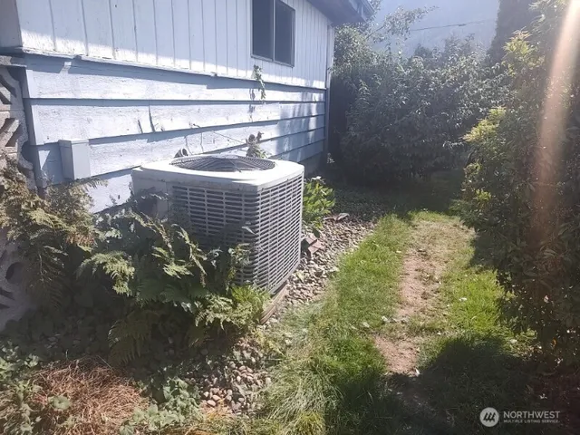 a front view of a house with washer and dryer