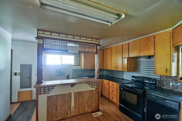 a kitchen with a stove and a sink