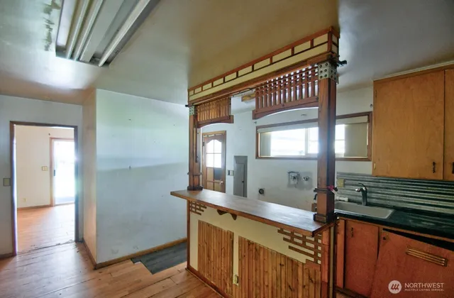a view of a bathroom with a sink and mirror