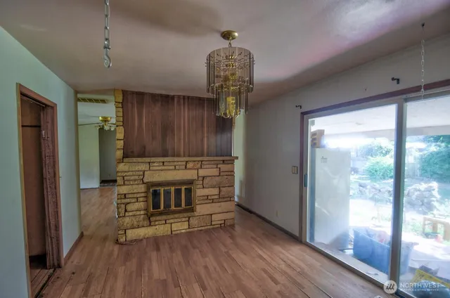 a view of an entryway with wooden floor
