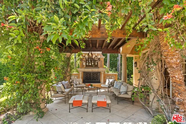 a balcony with furniture and a potted plant