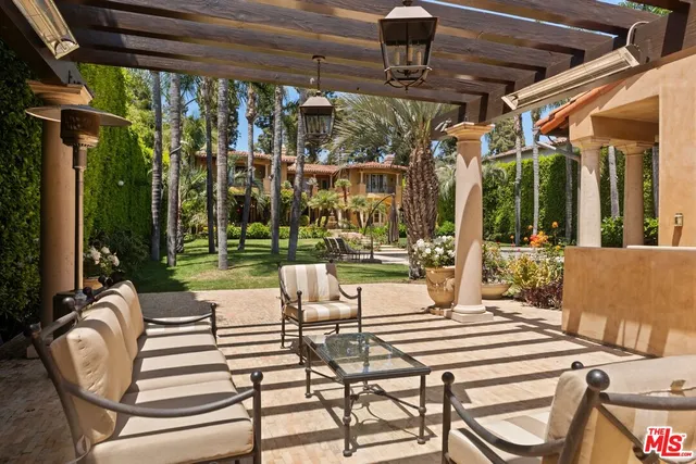 a view of a patio with swimming pool table and chairs