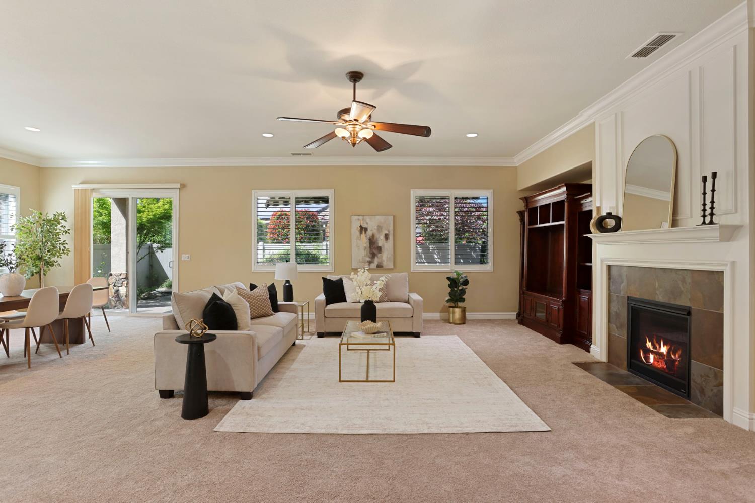 2439 Appleleaf Lane Manteca, CA 95336 - Photo 13 of 73 a living room with furniture large window and fireplace