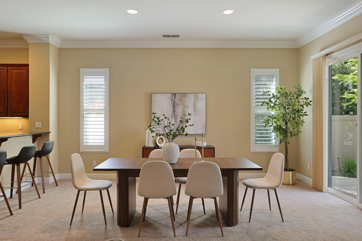2439 Appleleaf Lane Manteca, CA 95336 - Photo 15 of 73 a view of a dining room with furniture and a potted plant