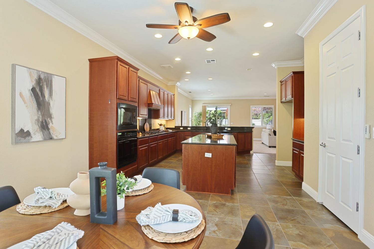 2439 Appleleaf Lane Manteca, CA 95336 - Photo 22 of 73 a living room with furniture and a dining table with kitchen view