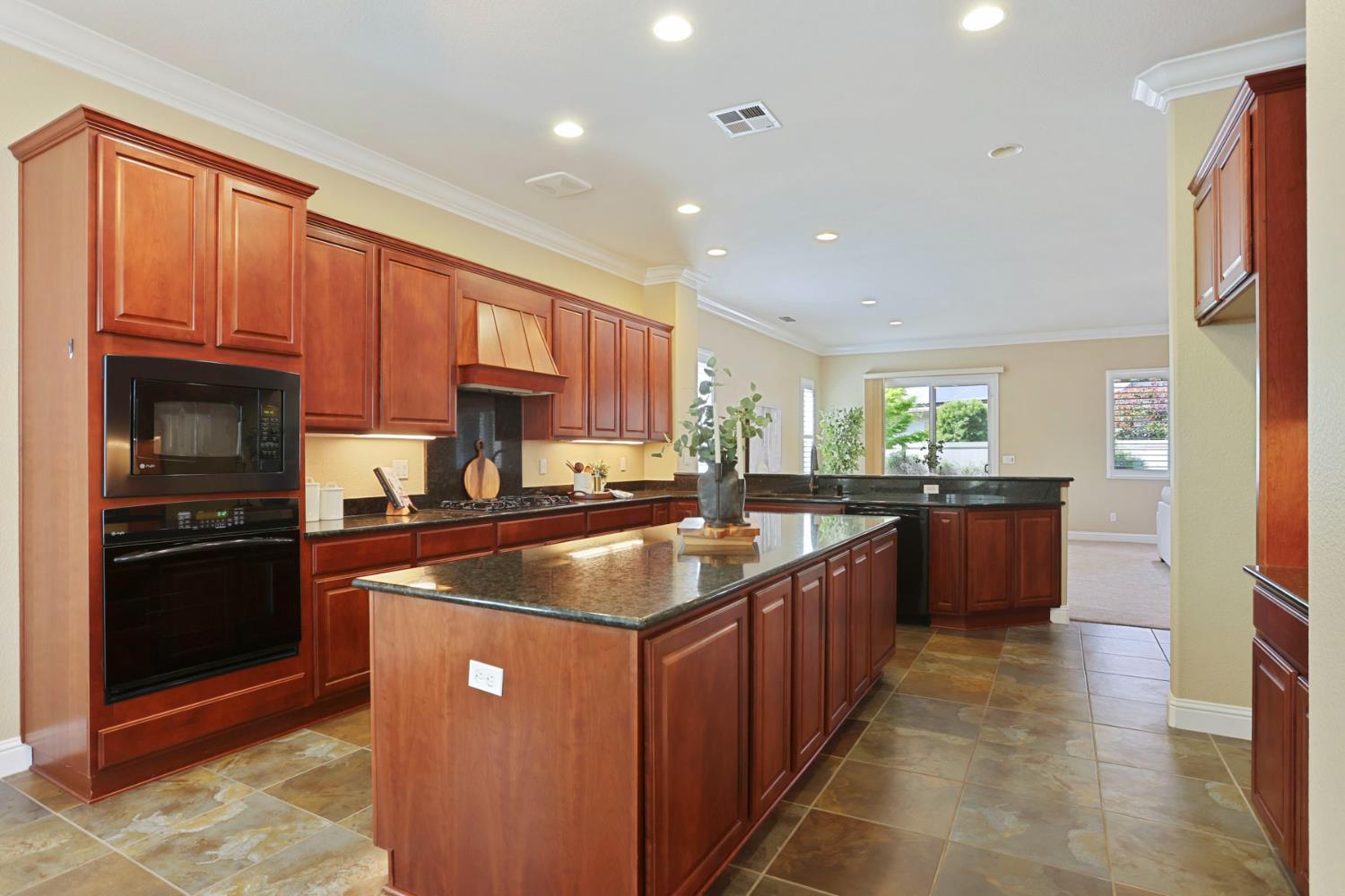 2439 Appleleaf Lane Manteca, CA 95336 - Photo 23 of 73 a kitchen with stainless steel appliances granite countertop a stove a sink dishwasher a refrigerator and a oven