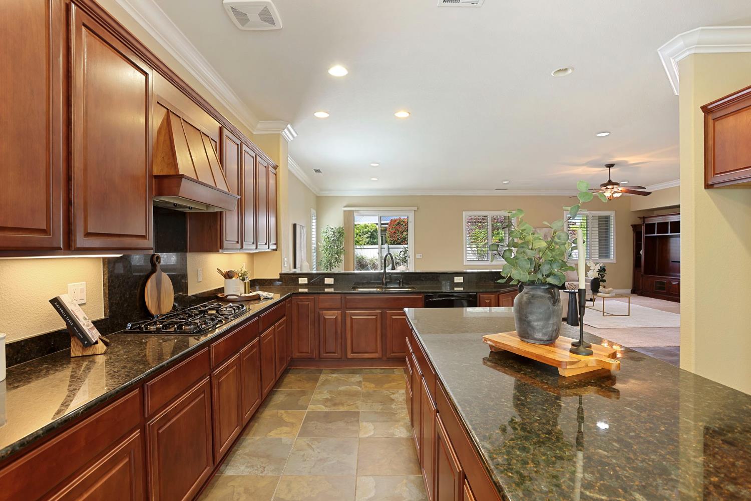 2439 Appleleaf Lane Manteca, CA 95336 - Photo 24 of 73 a kitchen with kitchen island granite countertop a sink and counter top space