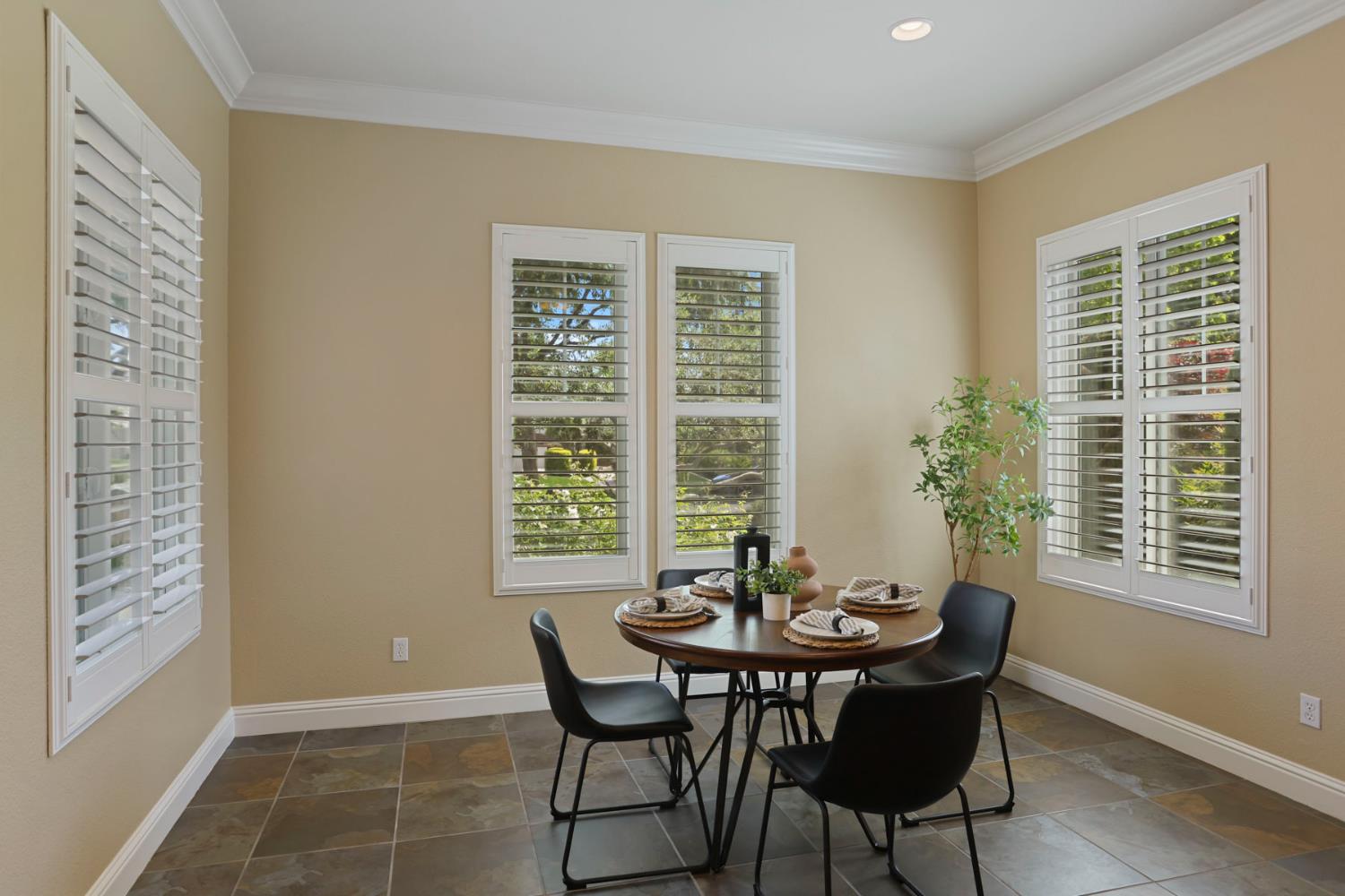 2439 Appleleaf Lane Manteca, CA 95336 - Photo 26 of 73 a view of a dining room with furniture and windows
