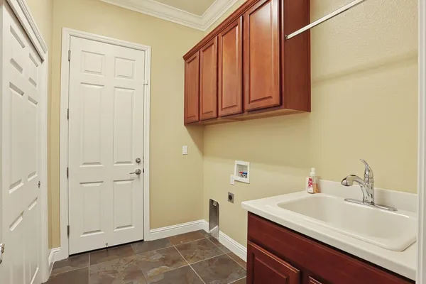 a bathroom with a granite countertop sink a toilet and a bathtub