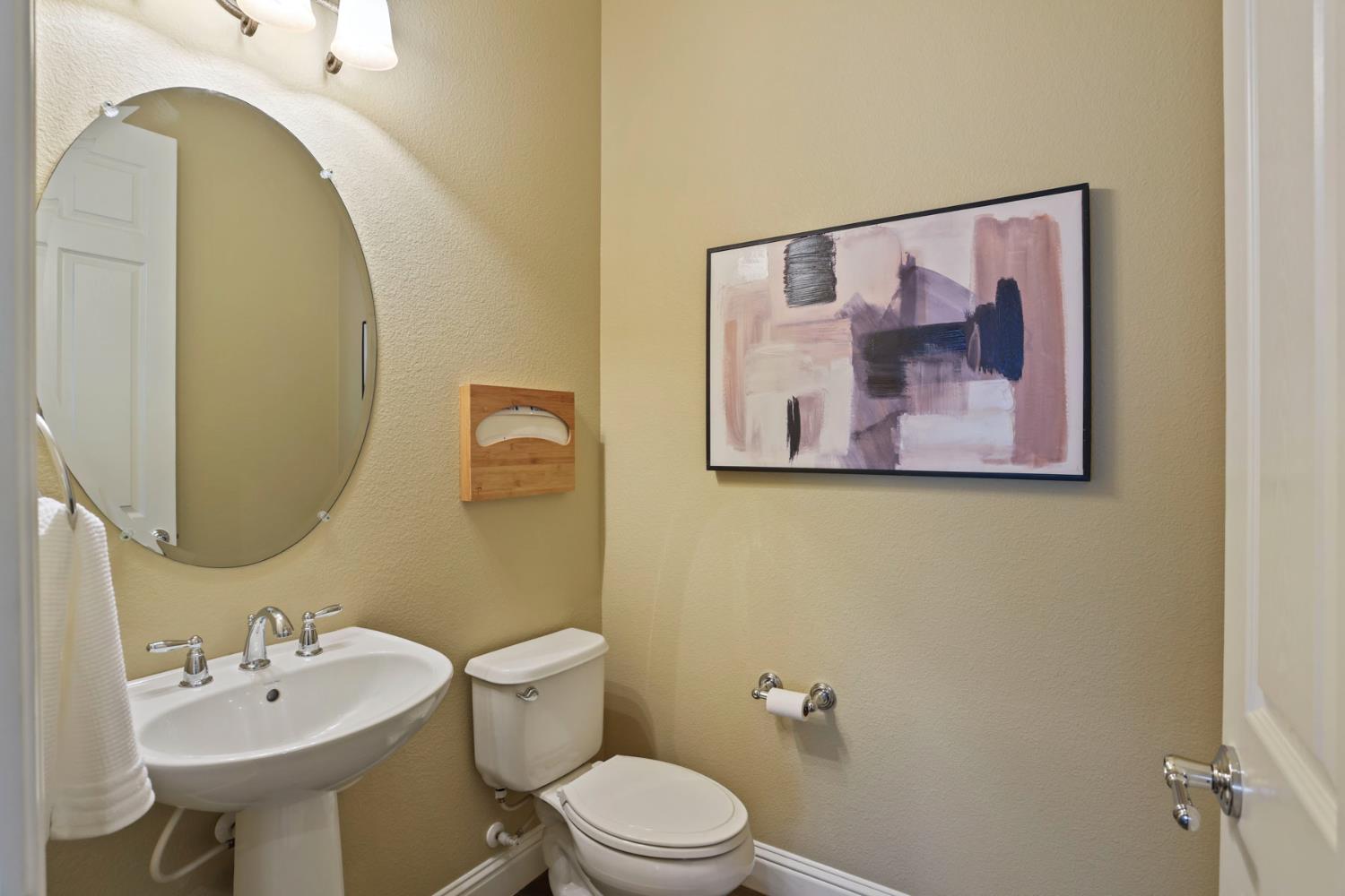 2439 Appleleaf Lane Manteca, CA 95336 - Photo 29 of 73 a bathroom with a toilet sink and mirror
