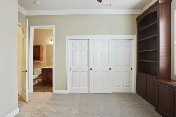 a view of an empty room with shelves