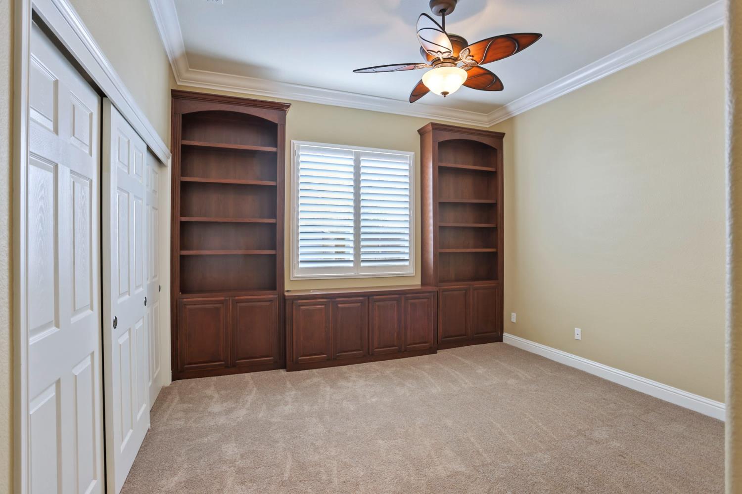 2439 Appleleaf Lane Manteca, CA 95336 - Photo 31 of 73 an empty room with windows and fan