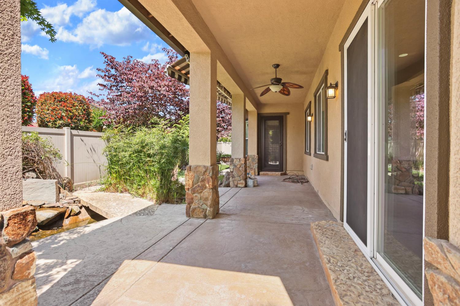 2439 Appleleaf Lane Manteca, CA 95336 - Photo 42 of 73 a view of a patio with table and chairs and potted plants