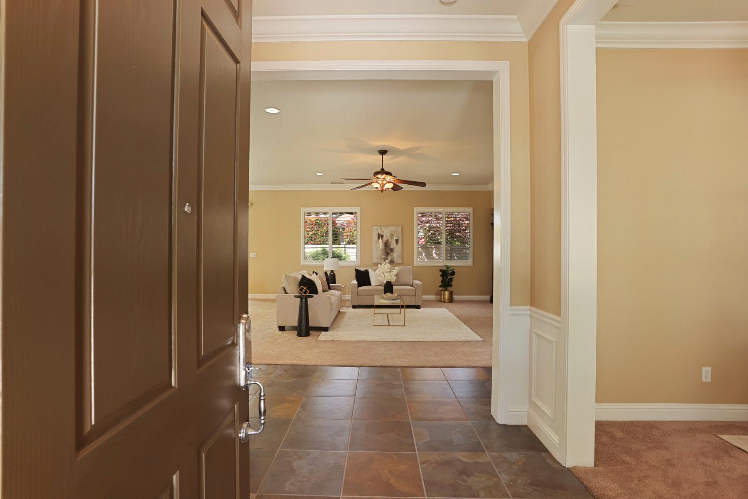 2439 Appleleaf Lane Manteca, CA 95336 - Photo 10 of 73 a view of a hallway with living room and furniture