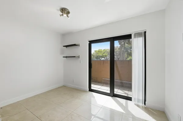 a view of empty room with floor to ceiling window