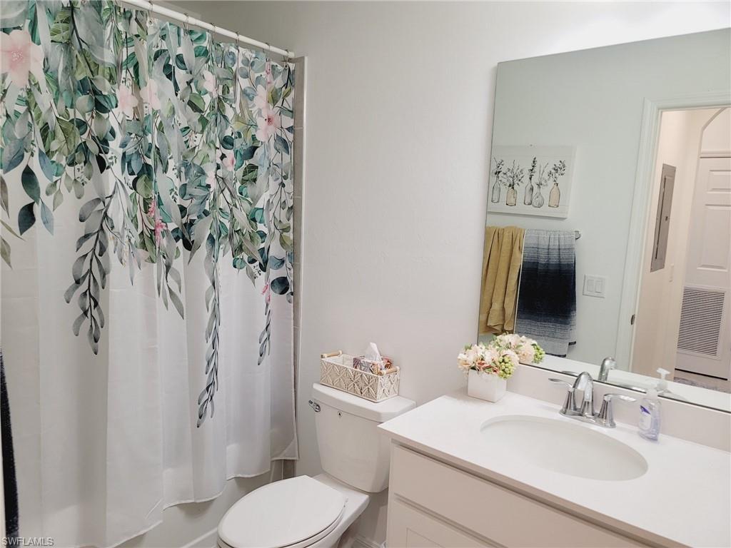 43997 Boardwalk Loop, Unit 1832 Babcock Ranch, FL 33982 - Photo 14 of 22 a bathroom with a sink toilet and shower