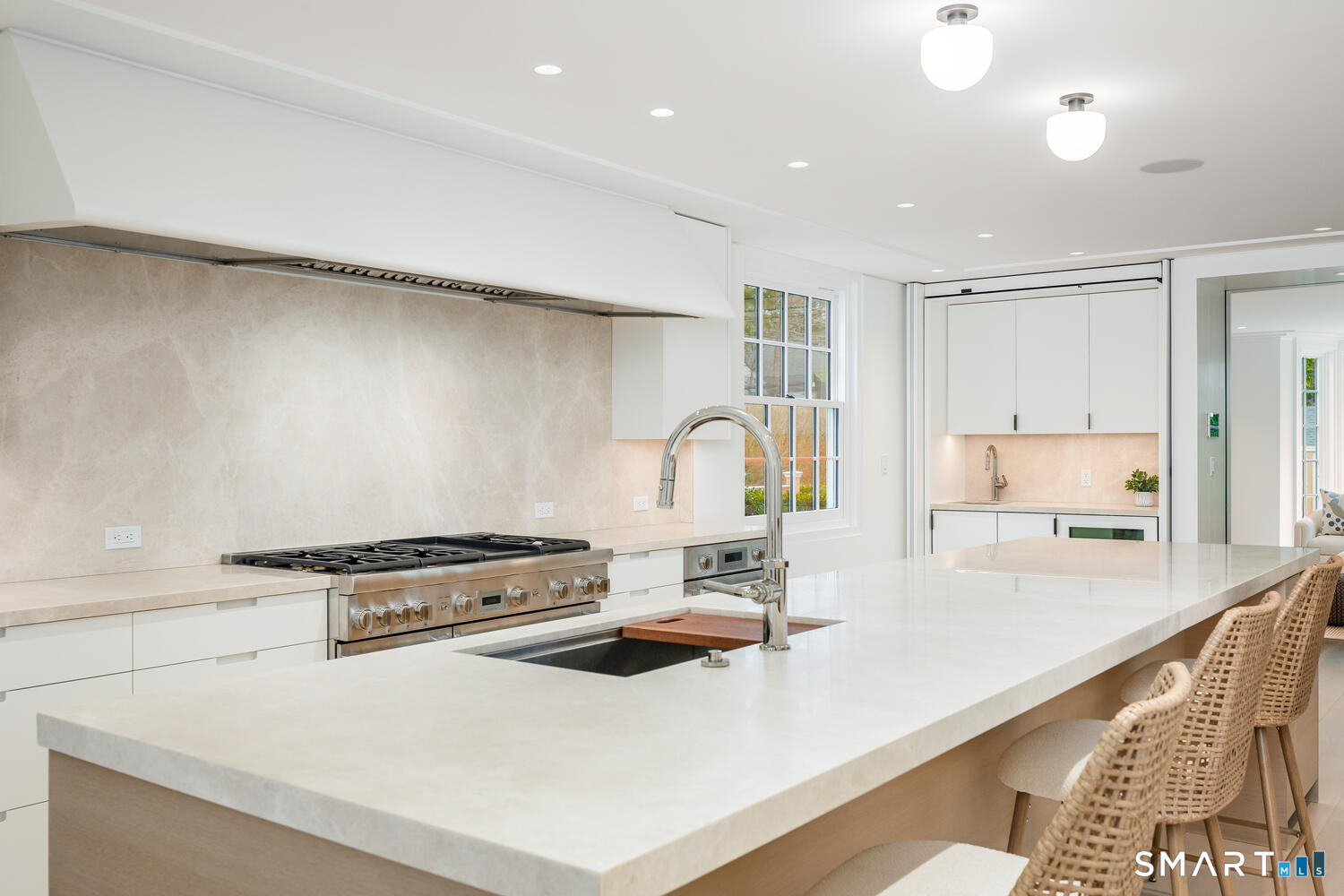 32 Birch Road Darien, CT 06820 - Photo 11 of 40 a kitchen with a stove a sink and a refrigerator