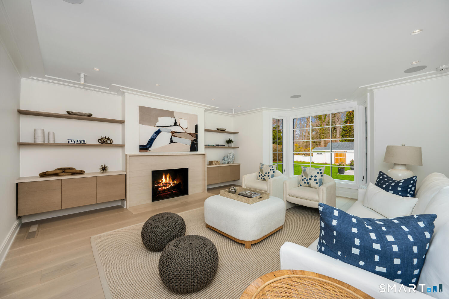 32 Birch Road Darien, CT 06820 - Photo 15 of 40 a living room with furniture and a fireplace