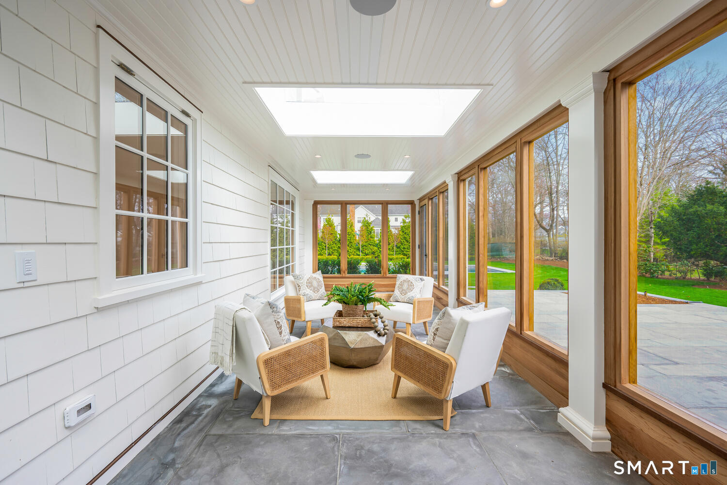 32 Birch Road Darien, CT 06820 - Photo 17 of 40 a living room with furniture and a large window