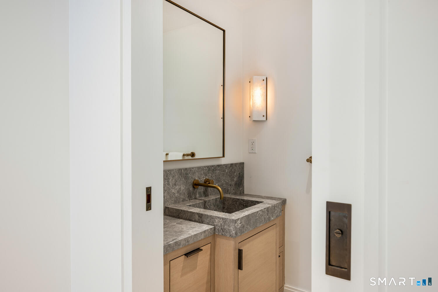 32 Birch Road Darien, CT 06820 - Photo 18 of 40 a bathroom with a sink and a mirror