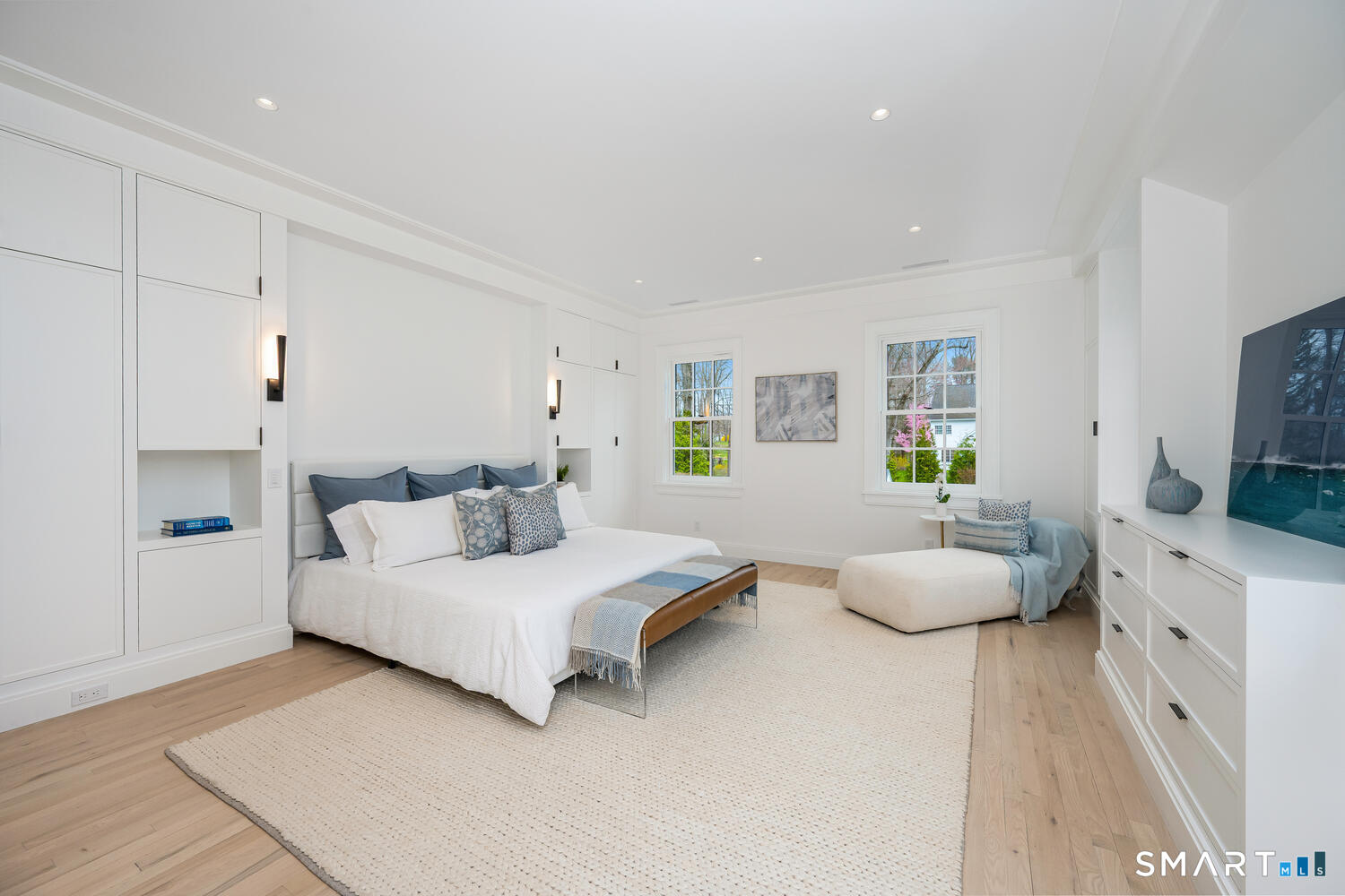 32 Birch Road Darien, CT 06820 - Photo 21 of 40 a bedroom with a bed and a flat screen tv