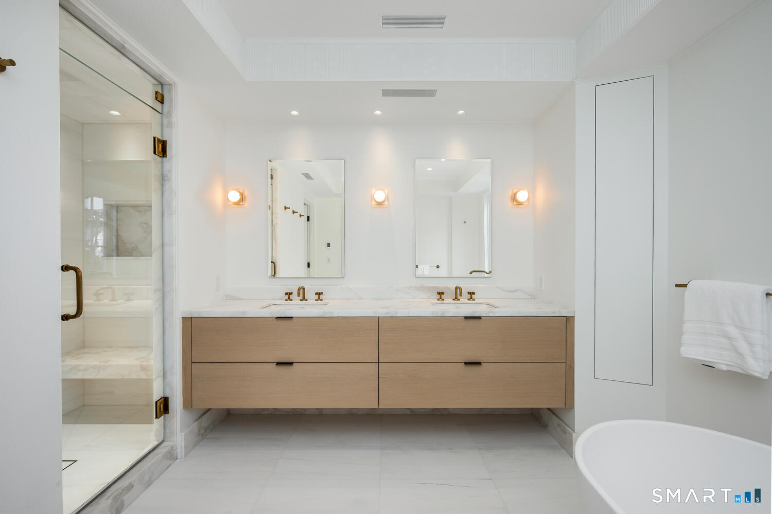 32 Birch Road Darien, CT 06820 - Photo 23 of 40 a bathroom with a double vanity sink mirror double and bathtub