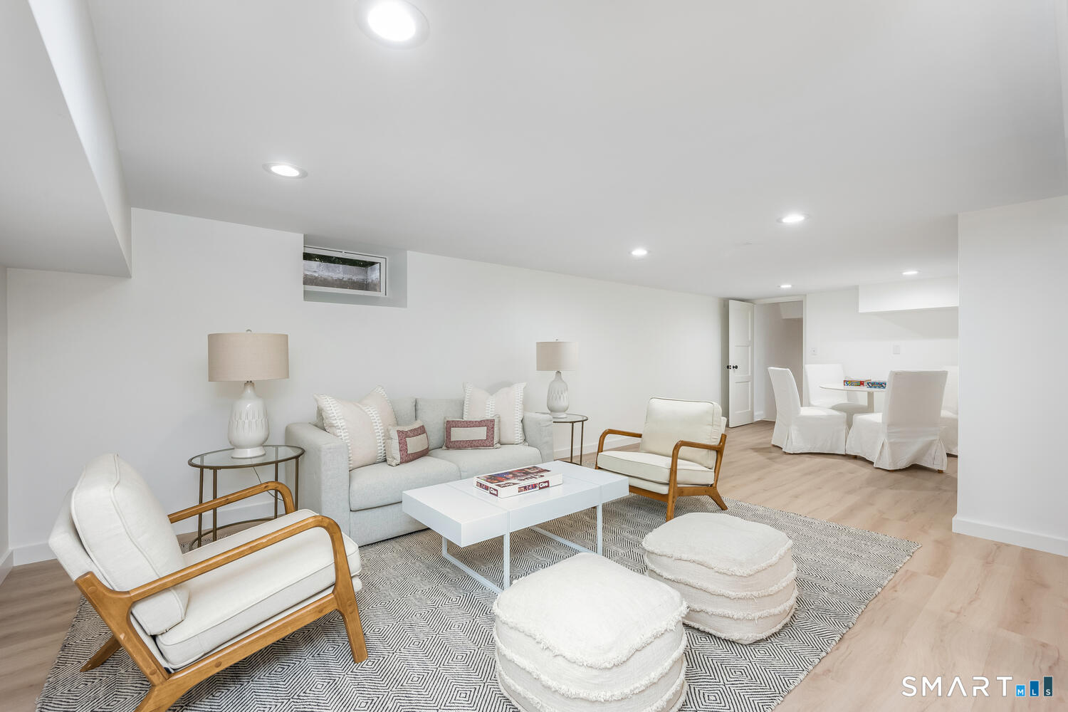 32 Birch Road Darien, CT 06820 - Photo 30 of 40 a living room with furniture a rug and a table